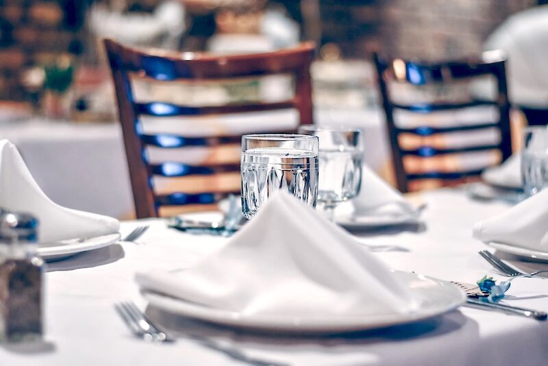 clear glass cup on table. Photo by Ibrahim Boran, Unsplash.